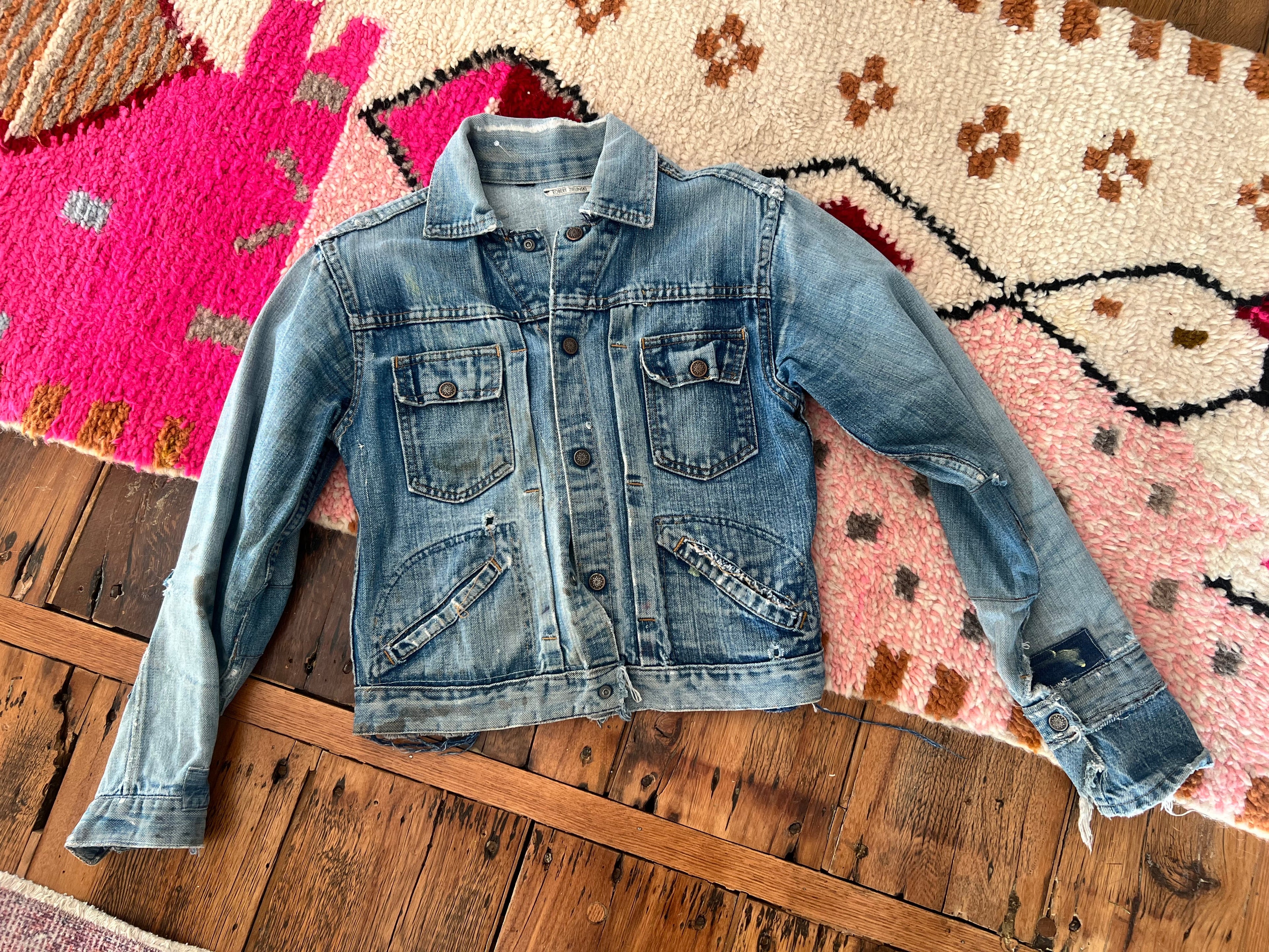 70's Worn patched denim jacket with painted back.